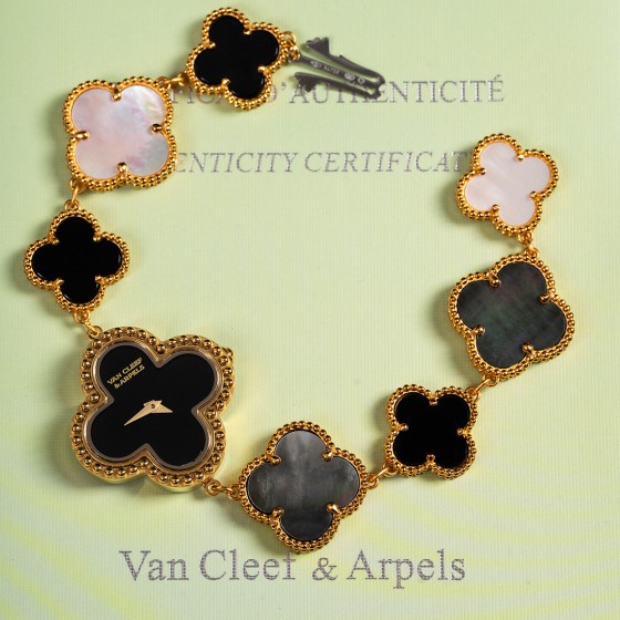 Van Cleef & Arpels Alhambra watch with black and white mother-of-pearl clover motifs and a black dial.